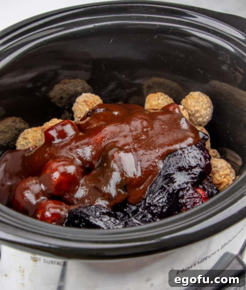 frozen meatballs, grape jelly, bbq sauce in a crock pot.