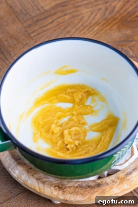 Butter and flour mixed together in a pot.