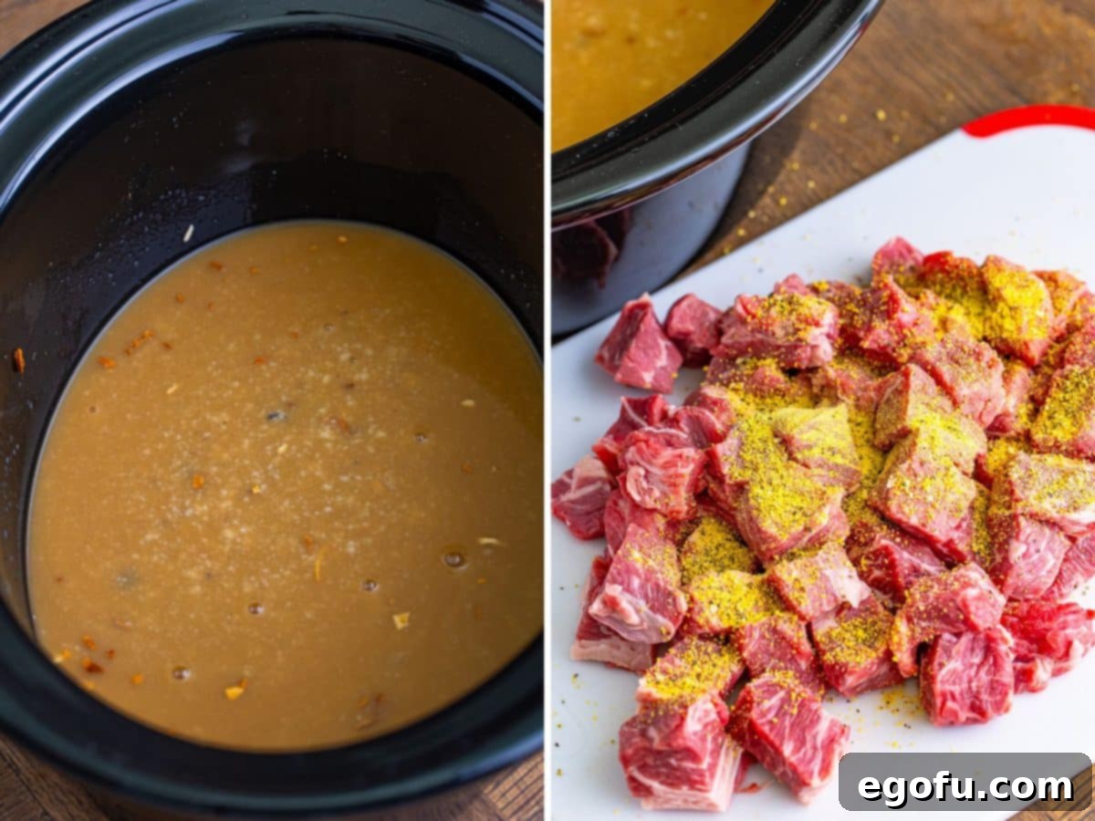 A Crockpot with a creamy sauce and a cutting board with cut up beef seasoned with lemon pepper.