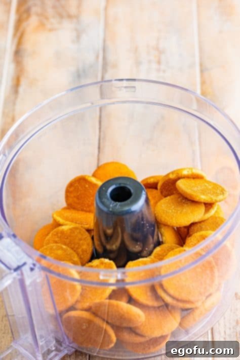 Golden Banana Dream Pie 15 Nilla wafers in a food processor, being crushed into fine crumbs for the pie crust.