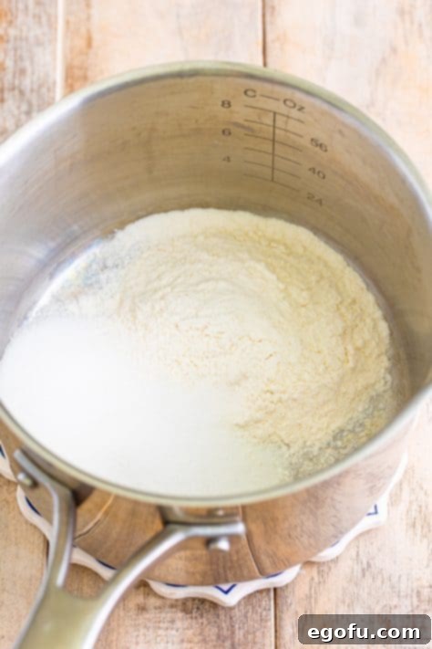 Golden Banana Dream Pie 18 Flour, sugar, and salt ready in a saucepan, beginning the pudding preparation.