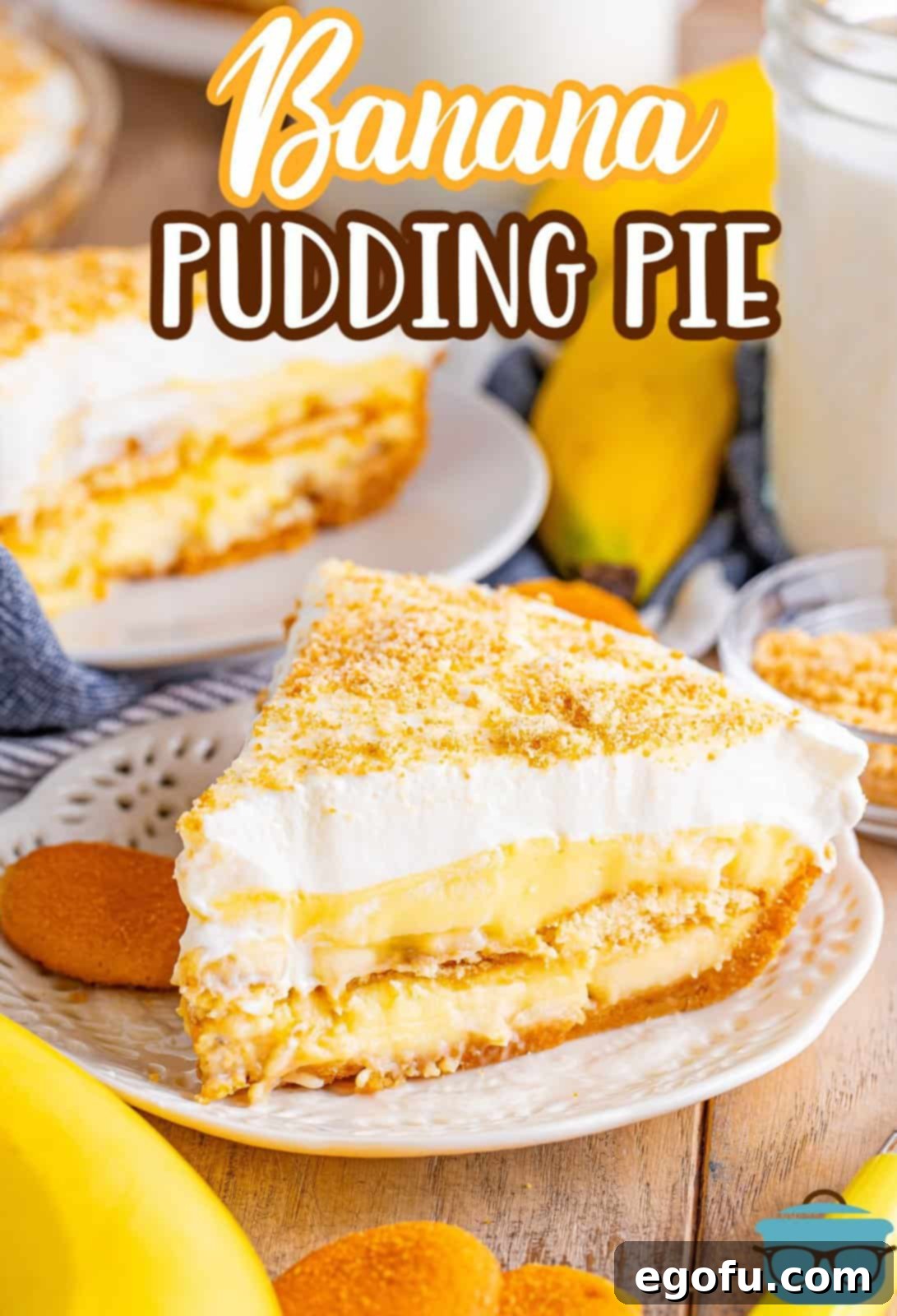 Golden Banana Dream Pie 3 A perfectly sliced banana pudding pie resting on a pristine white plate, with the rest of the pie subtly blurred in the background, showcasing its inviting texture and golden crust.