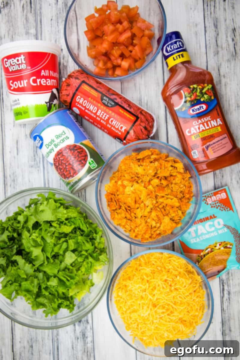 Doritos Fiesta Salad 4 A visual collage of the main ingredients required for Doritos Taco Salad, including ground beef, taco seasoning, Doritos, beans, lettuce, cheese, tomatoes, and dressing.