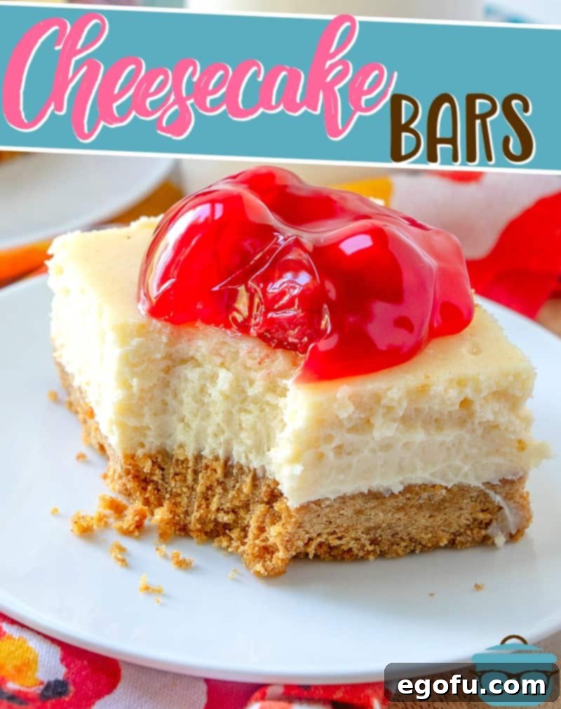 A close-up photograph of a delicious cherry cheesecake bar on a white plate with a bite taken out, revealing its rich, creamy texture and crumbly crust.