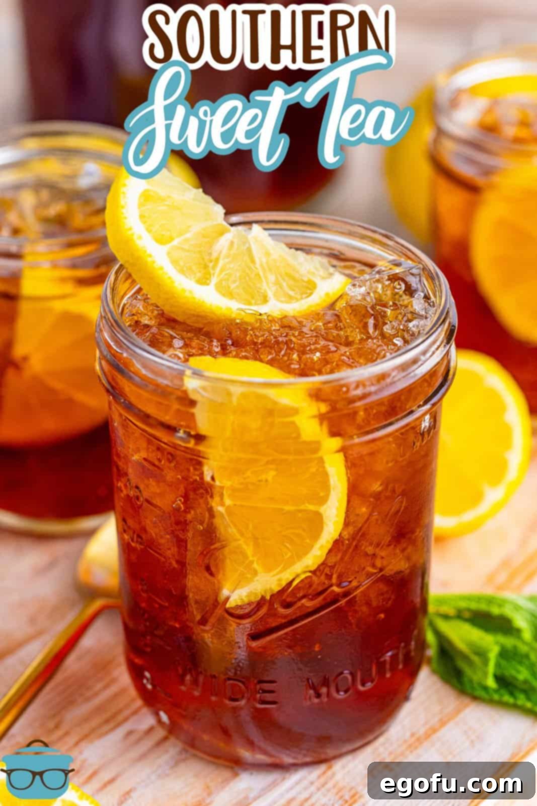 A single mason jar filled with Southern Sweet Tea and adorned with lemon slices, highlighting its refreshing quality.