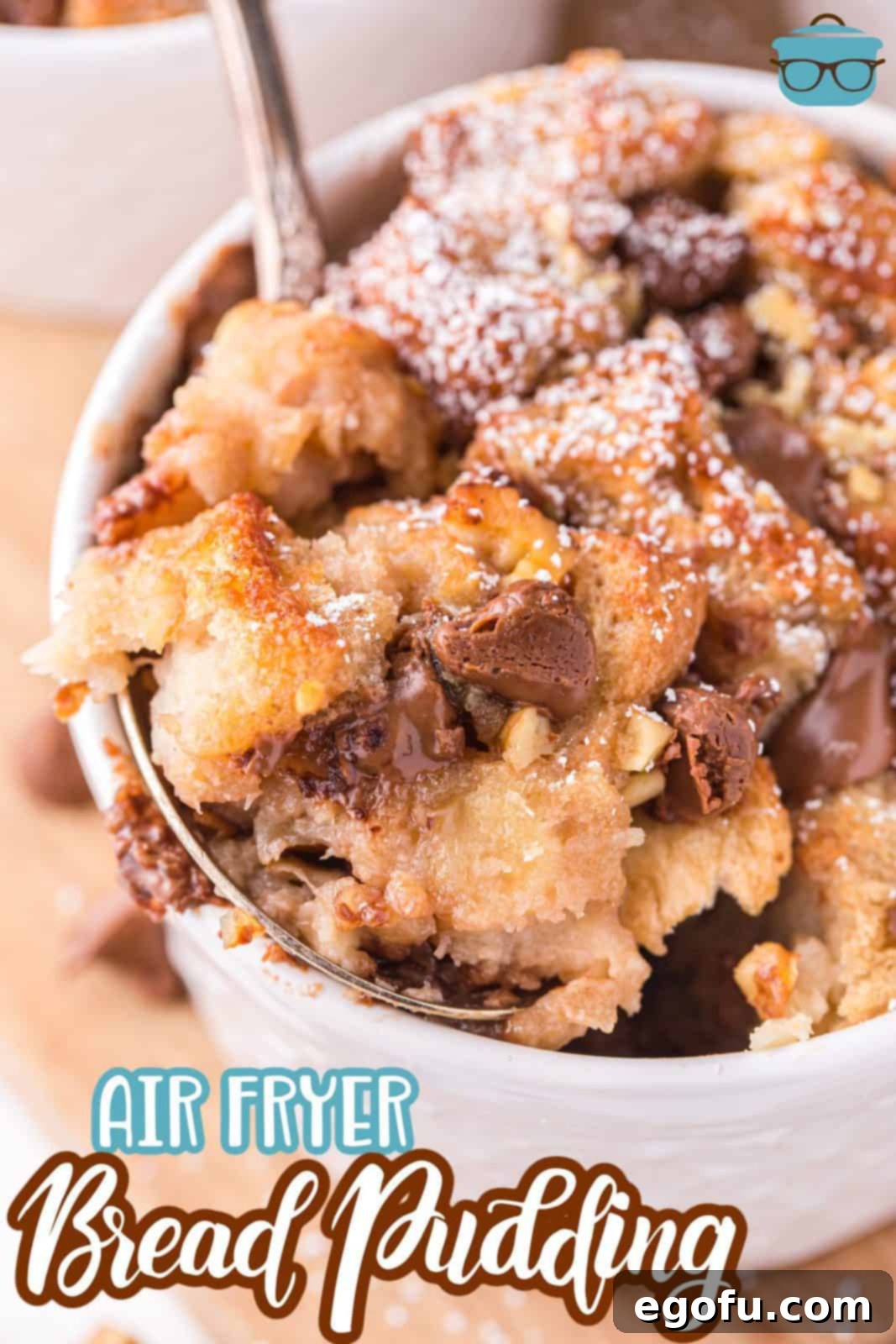 Pinterest image close up of Air Fryer Bread Pudding with some on spoon, highlighting the gooey chocolate and tender bread.