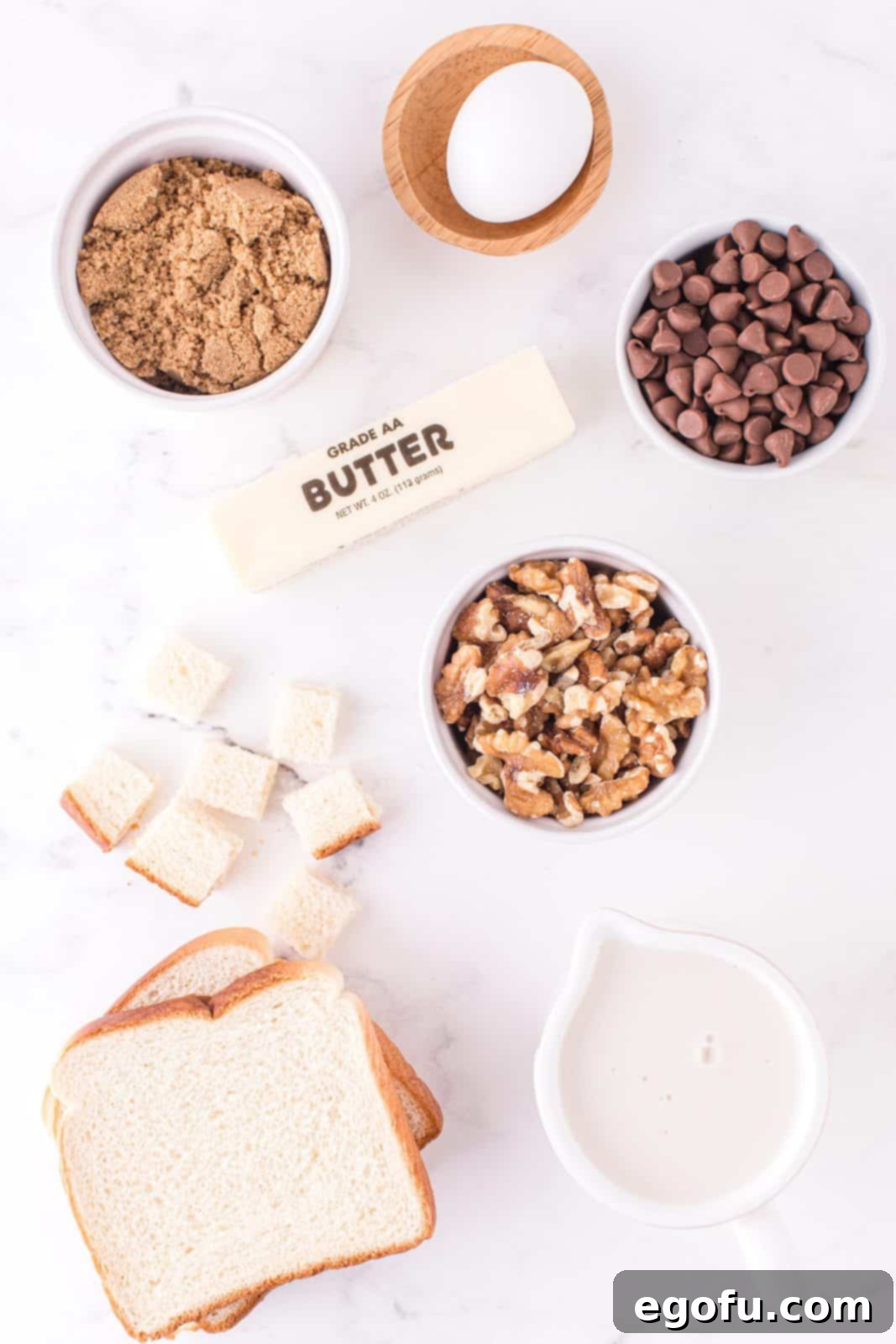 All ingredients laid out: vanilla almond milk, dark brown sugar, salted butter, egg, Texas Toast bread, walnuts and milk chocolate chips.