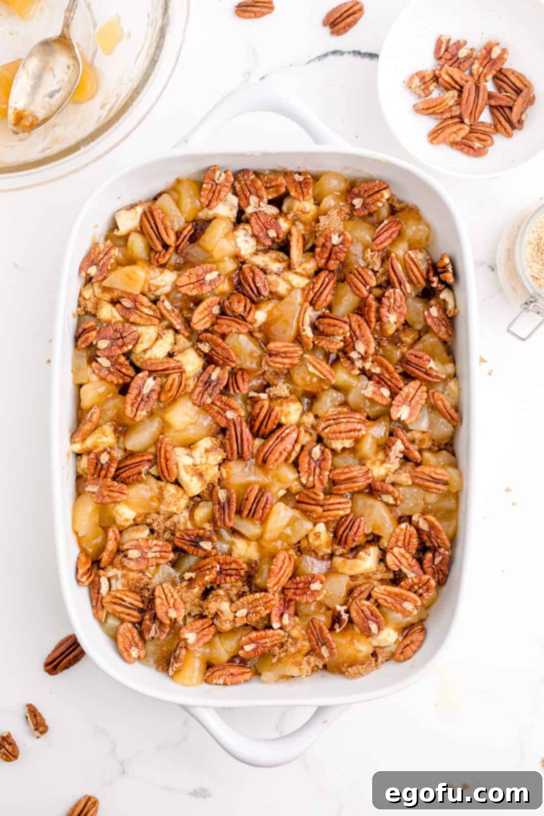 Gooey Cinnamon Roll Delight 11 Pecans topping casserole.