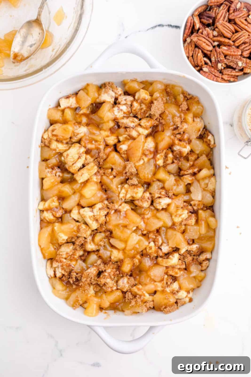 Gooey Cinnamon Roll Delight 10 Apple pie filling added on top of cinnamon brown sugar mixture.