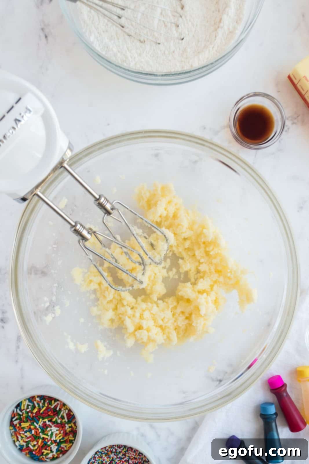 Butter and sugar creamed together in bowl.
