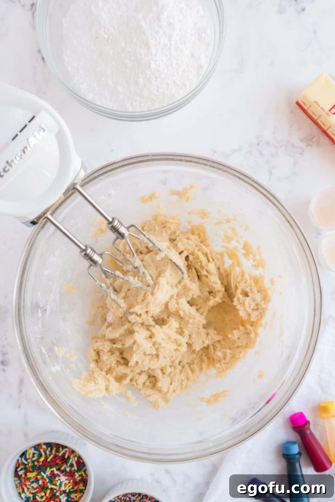 Dry ingredients mixed into batter in bowl.