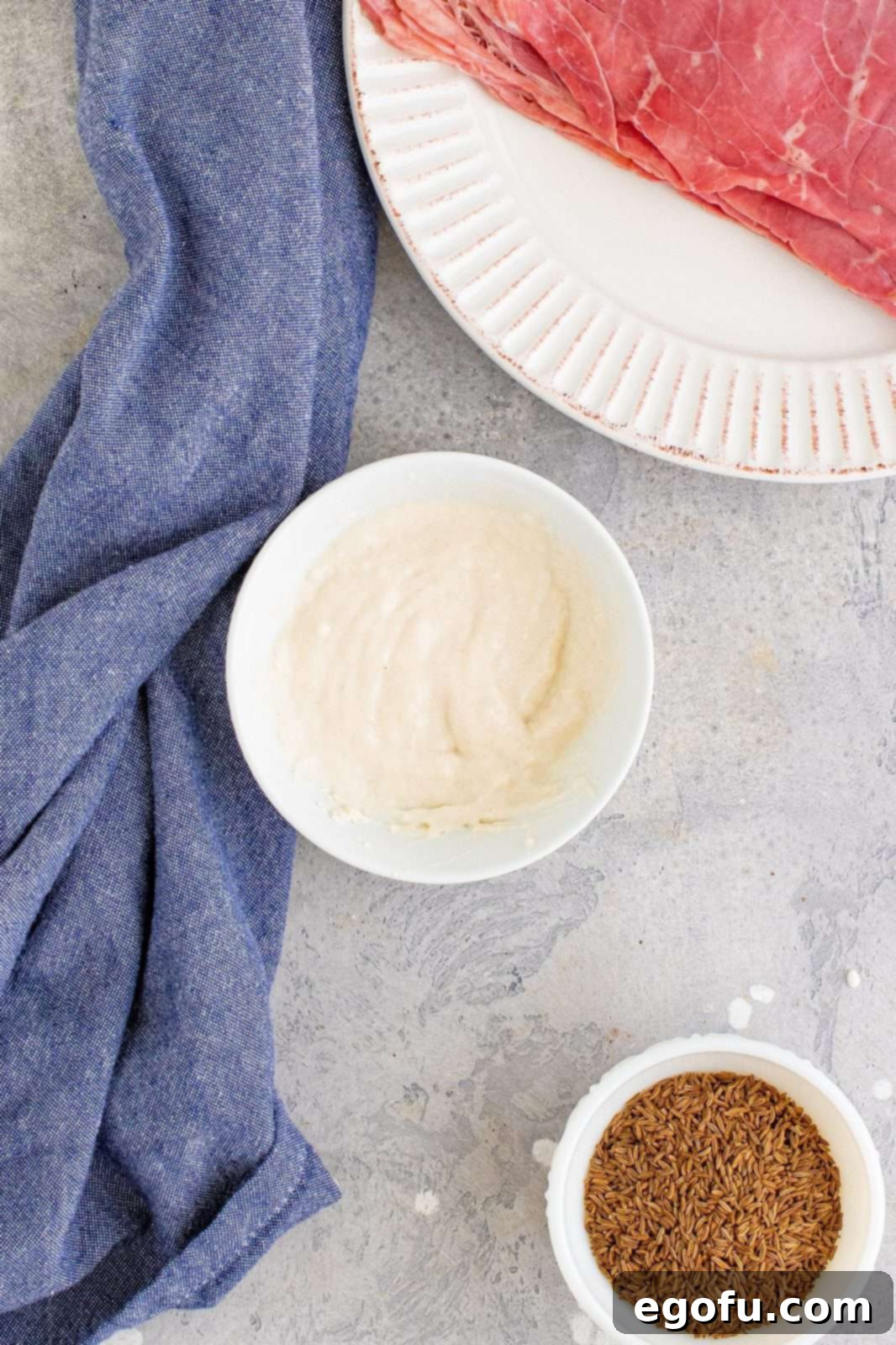 Water and flour mixed together in a small bowl to form a smooth paste.