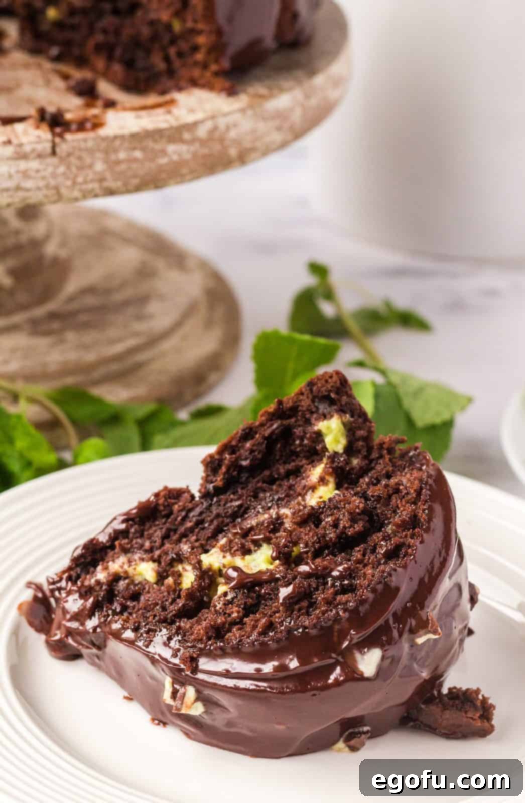 Slice of Mint Chocolate Bundt Cake on plate showing filling.