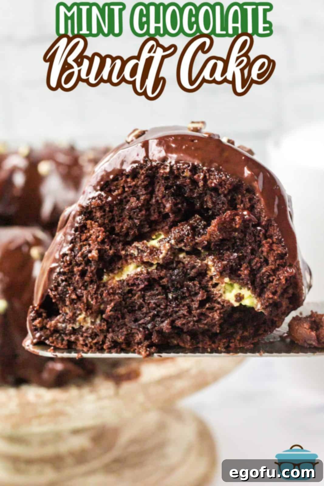 Slice of Mint Chocolate Bundt Cake being held up with spatula.