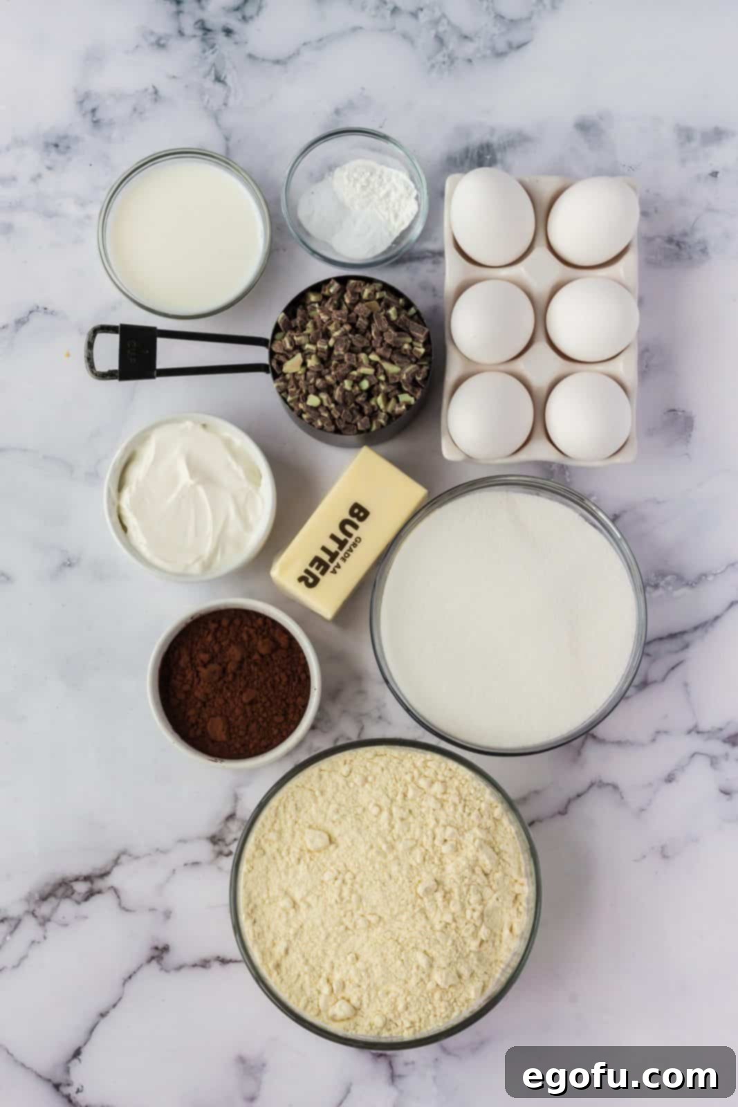 Ingredients needed: salted butter, granulated sugar, egg, sour cream, milk, all-purpose flour, dark cocoa powder, baking powder, baking sodaAndes mints baking chips, cream cheese, peppermint extract, green food coloring, dark chocolate chips and heavy cream.