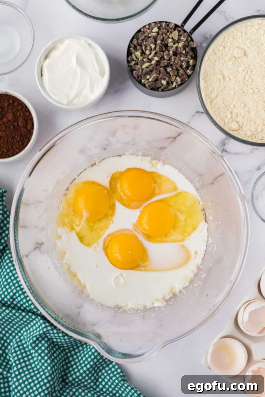 Eggs and milk in bowl.