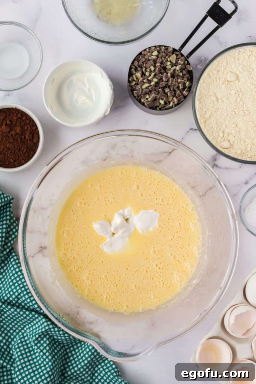 Sour cream added to the egg and milk mixture.