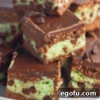 Square image showing layers of stacked Mint Cream Cheese Brownies.
