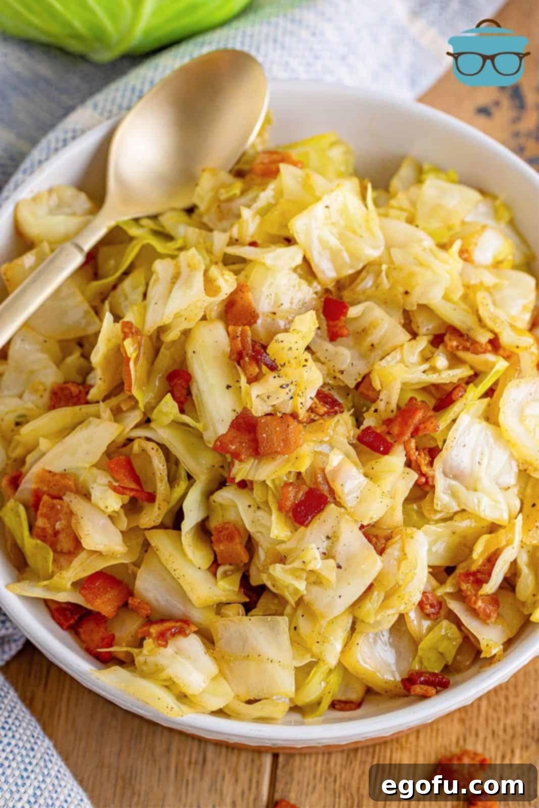 Crispy Bacon and Caramelized Cabbage 2 Delicious Southern Bacon Fried Cabbage ready to be served, showcasing crispy bacon bits and tender cabbage leaves.