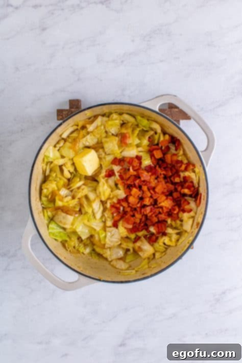 Crispy Bacon and Caramelized Cabbage 13 cooked bacon added to cooked cabbage in a stock pot.