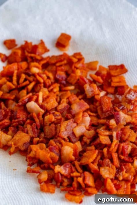 Crispy Bacon and Caramelized Cabbage 10 cooked bacon on a paper towel.