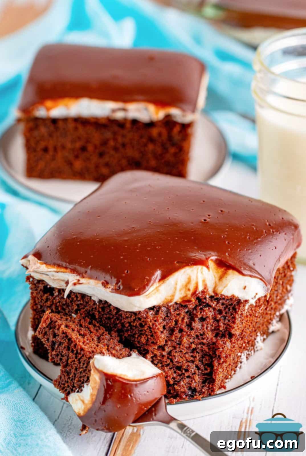 Two slices of Ding Dong Cake on plate with bite taken out of one.