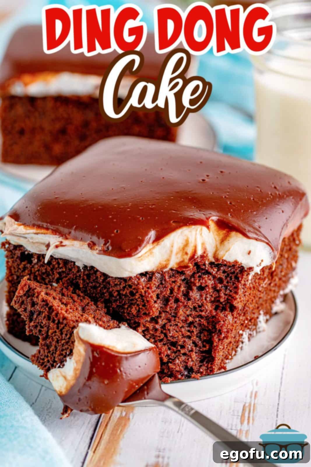 Pinterest image of slice of Ding Dong Cake on white plate with bite taken out.