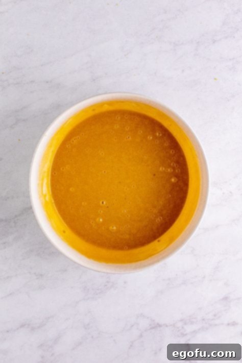 Half the dry mixture added to egg and brown sugar mixture.