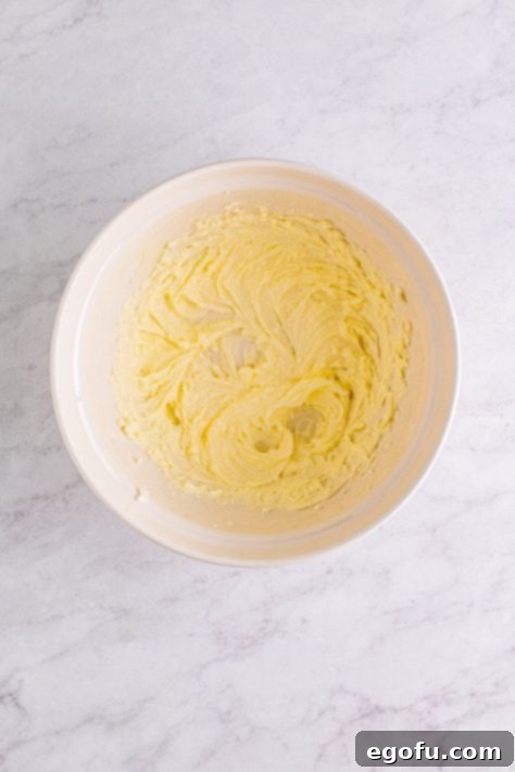 Butter and shortening added to bowl and beaten together.