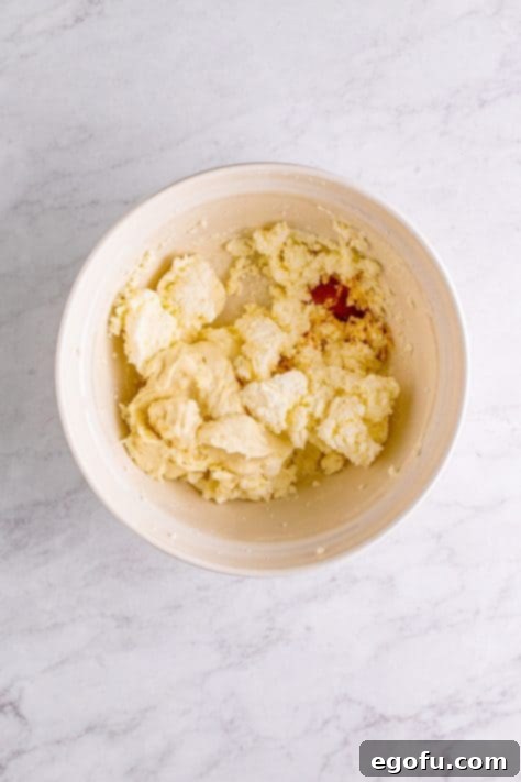 flour paste and vanilla added to powdered sugar, butter and shortening mixture.