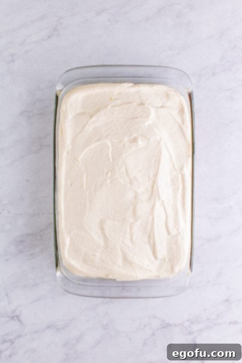 Filling spread over cake.