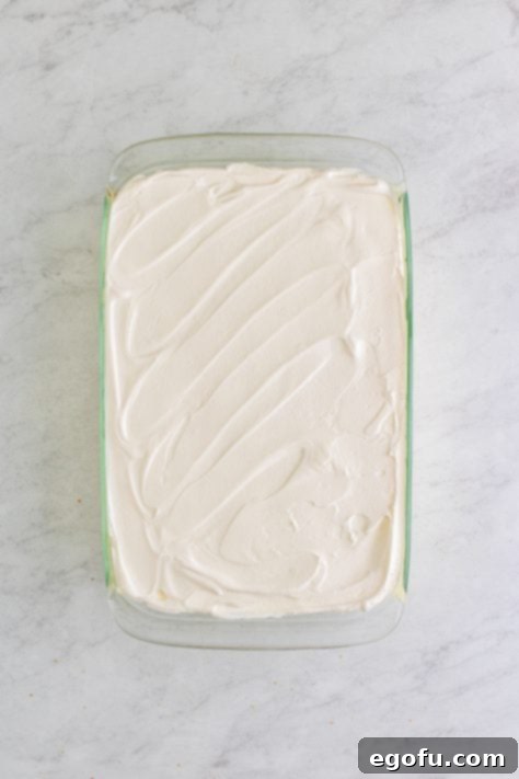 Icebox cake topped with whipped cream.