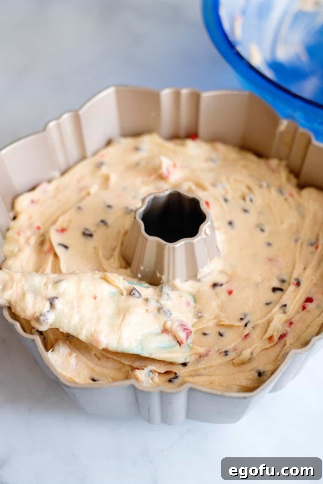 Cake batter spread into prepared pan.