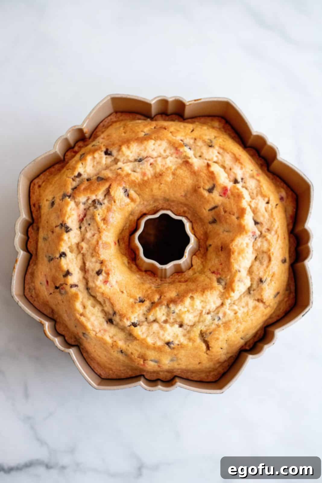 Finished cake in pan out of oven.