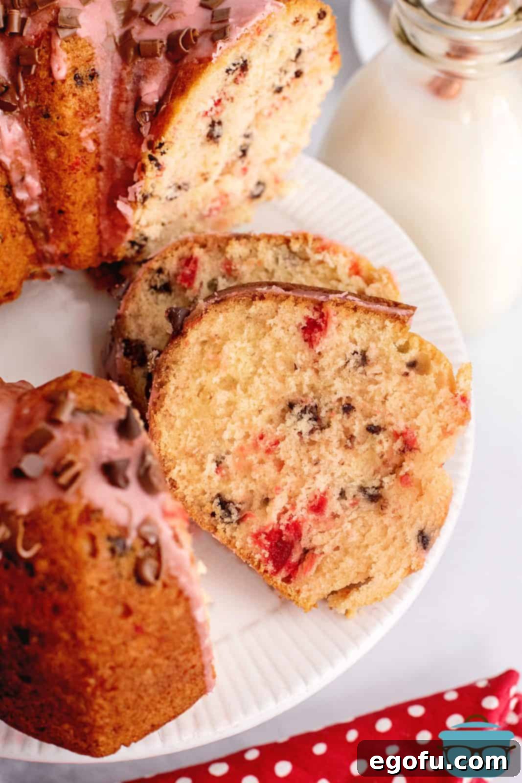 Overhead of slices of Cherry Chocolate Chip Cake laying on top of one another.
