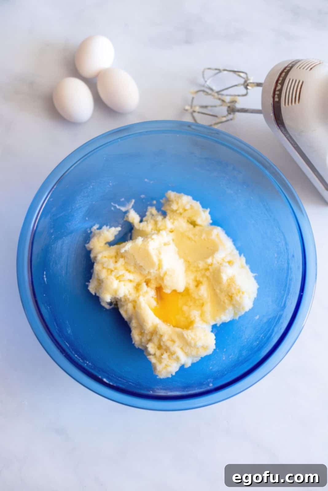 Butter and sugar mixed together in bowl.