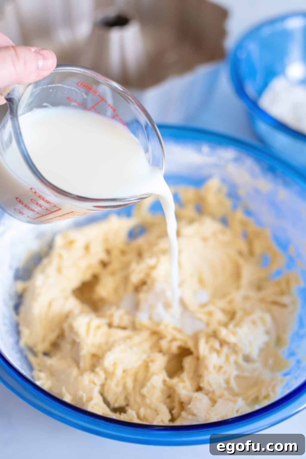 Milk being added to the flour and butter mixture.