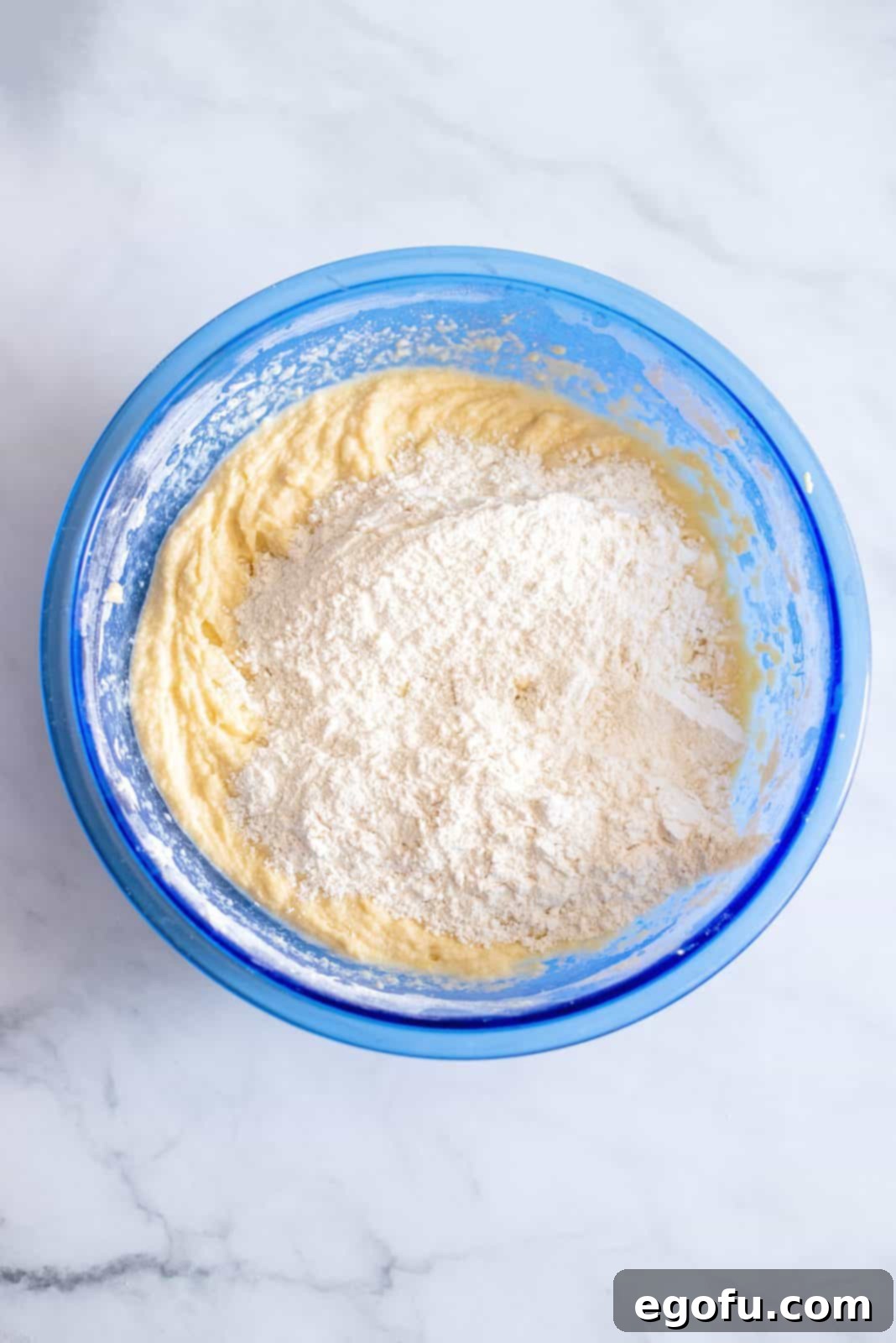 Remaining flour added to mixture in bowl.
