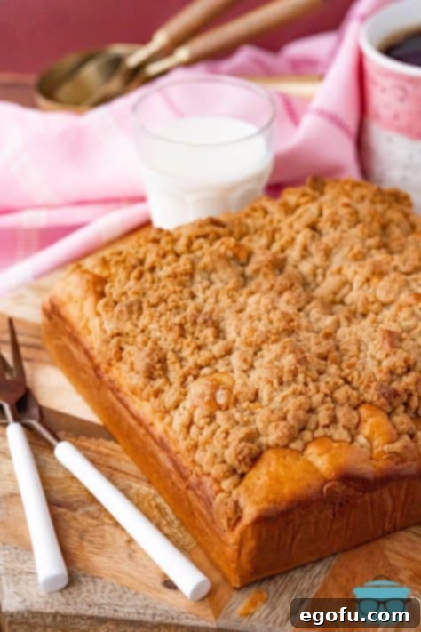 Finished uncut Bisquick Coffee Cake on cutting board.