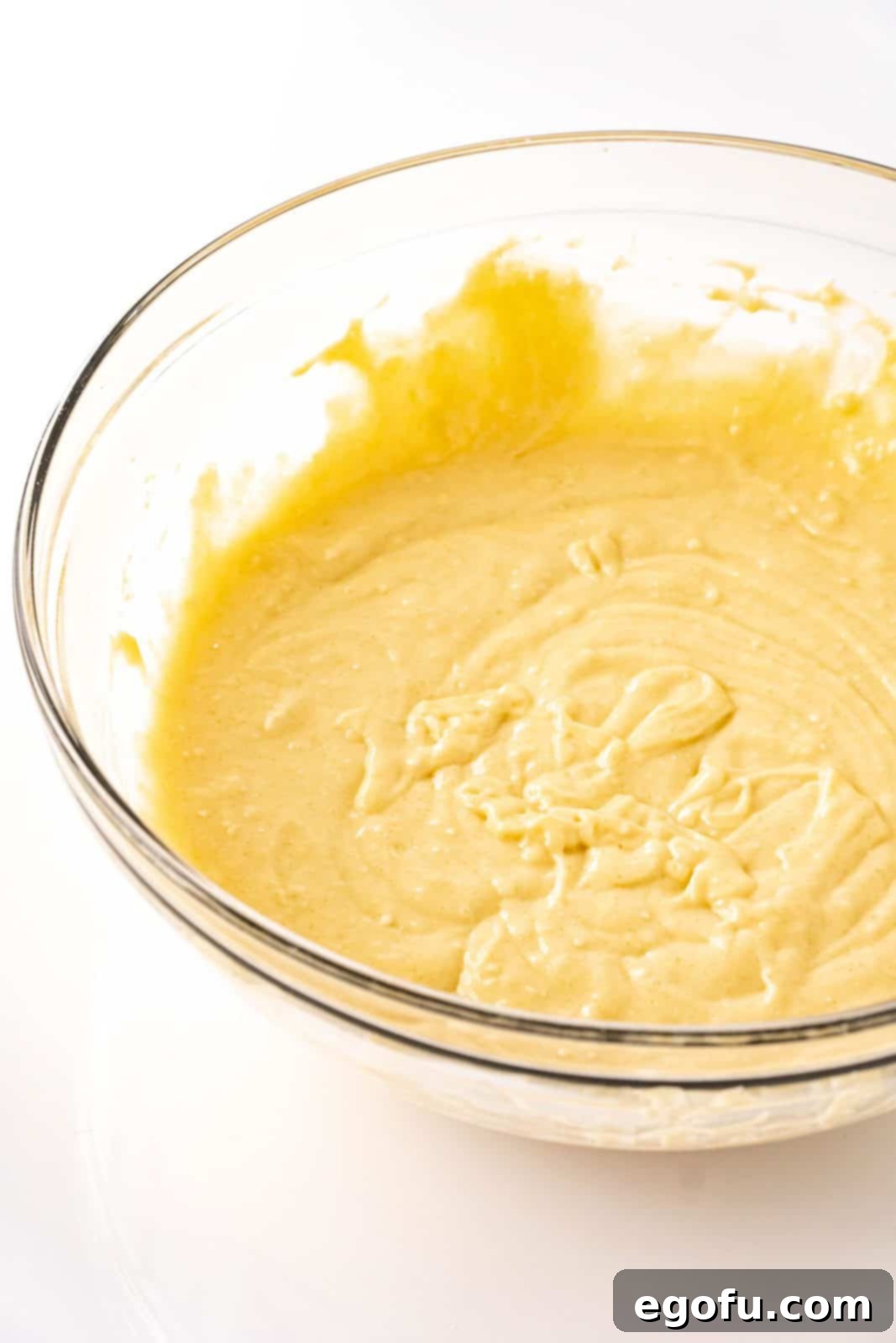The smooth, thick coffee cake batter perfectly mixed in a large bowl, ready for the baking pan.