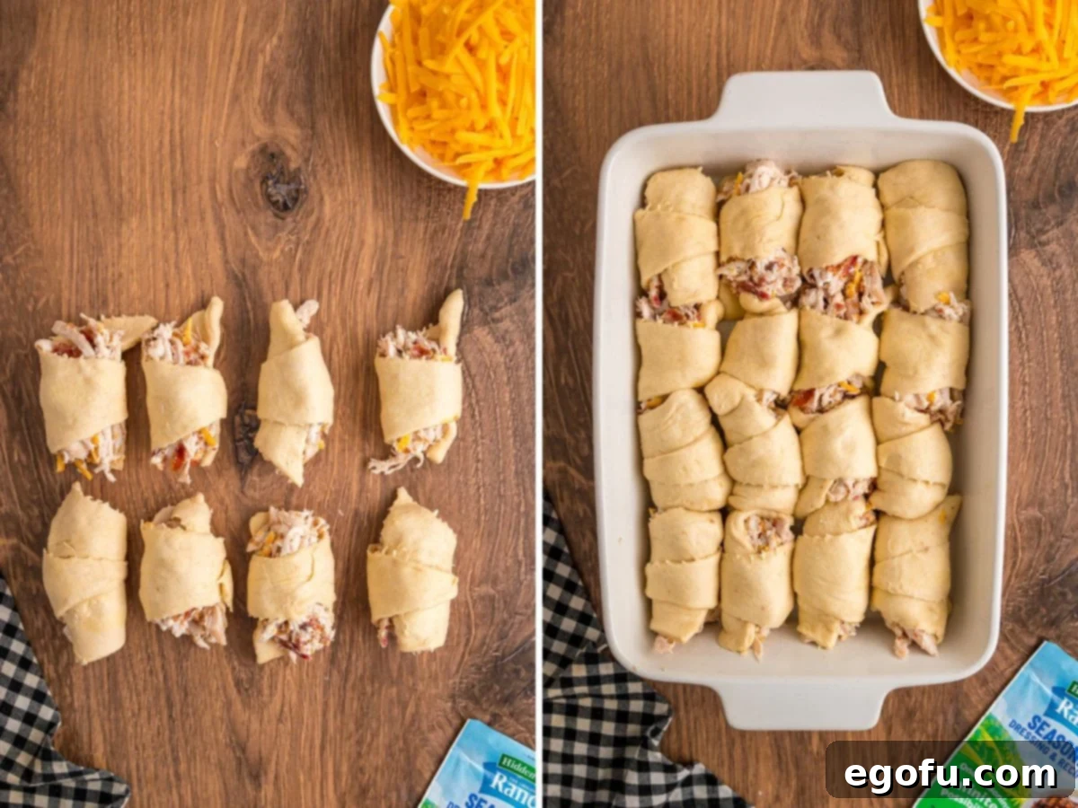 Cheesy Chicken Crescents 8 Rolled up and stuffed chicken crescent rolls waiting to be baked in a baking dish.