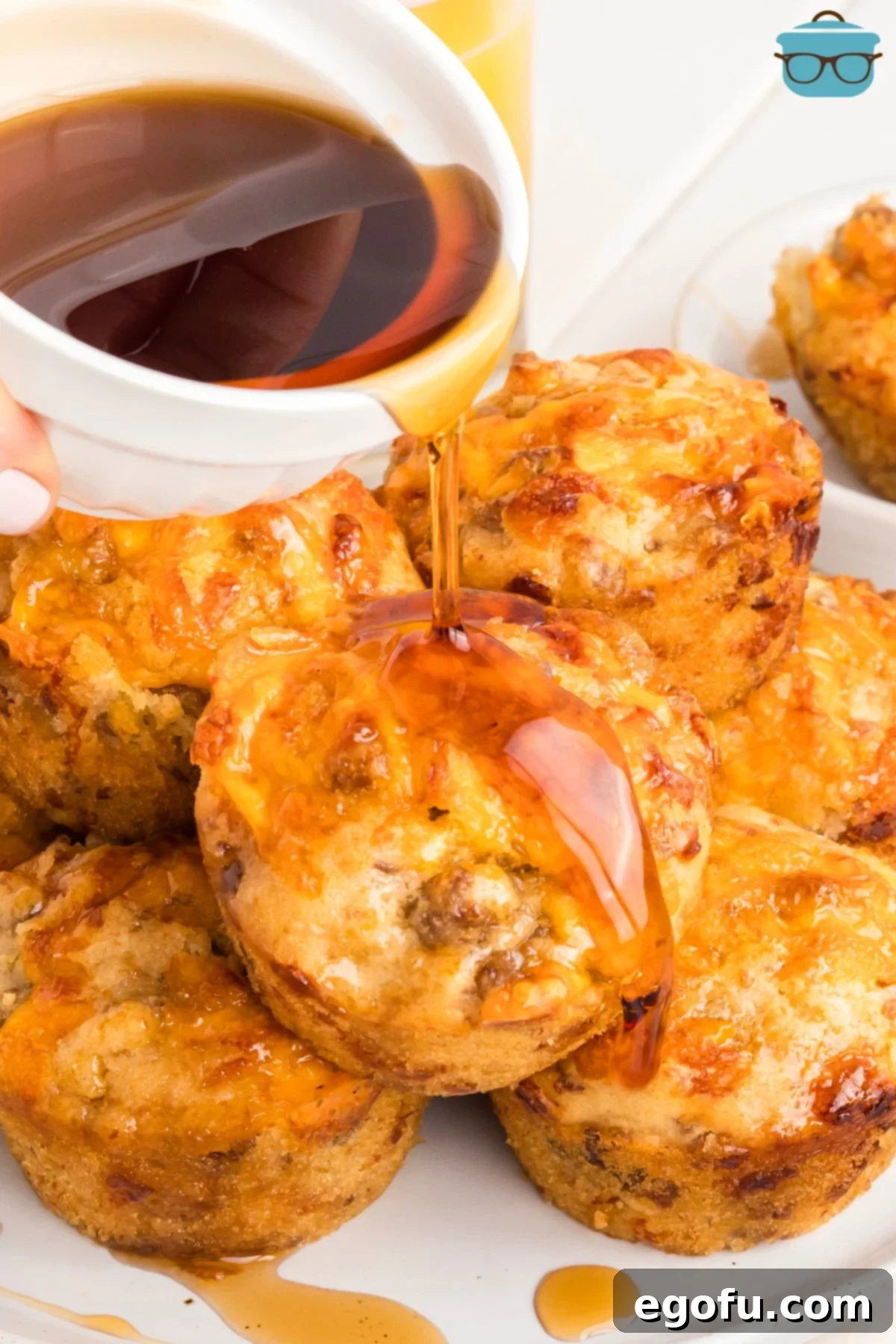 McGriddle Muffins
McMuffin Magic: Sweet & Savory Bites 2 A tempting stack of McGriddle Muffins on a plate, drizzled with luscious syrup.