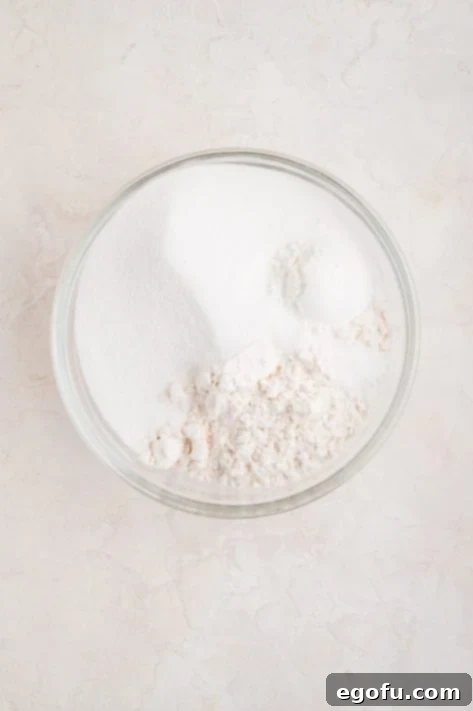 Peanut Butter & Jelly Swirl Muffins 12 A bowl of flour, sugar, baking powder and salt.