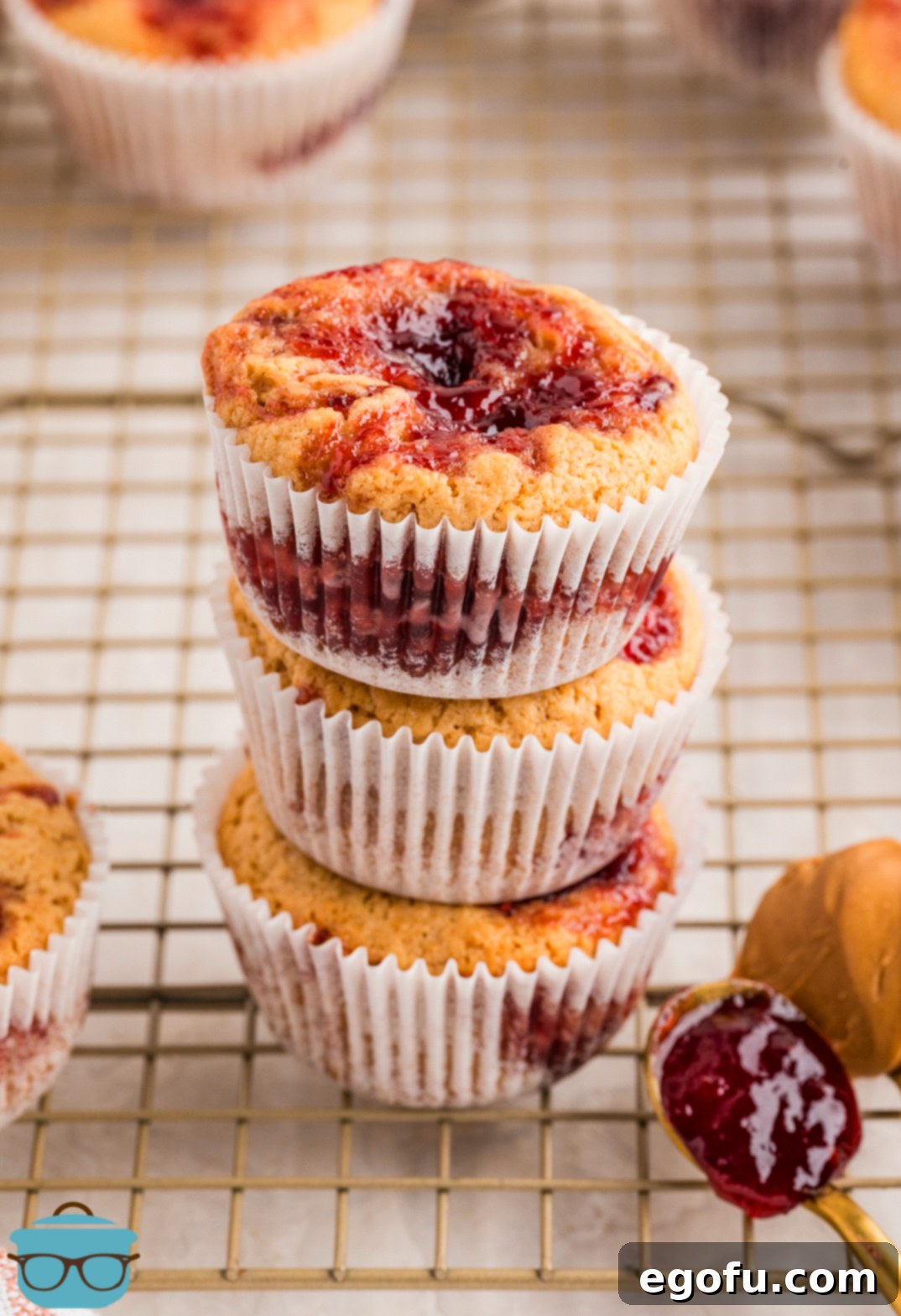 Peanut Butter & Jelly Swirl Muffins 10 A stack of Peanut Butter and Jelly Muffins.