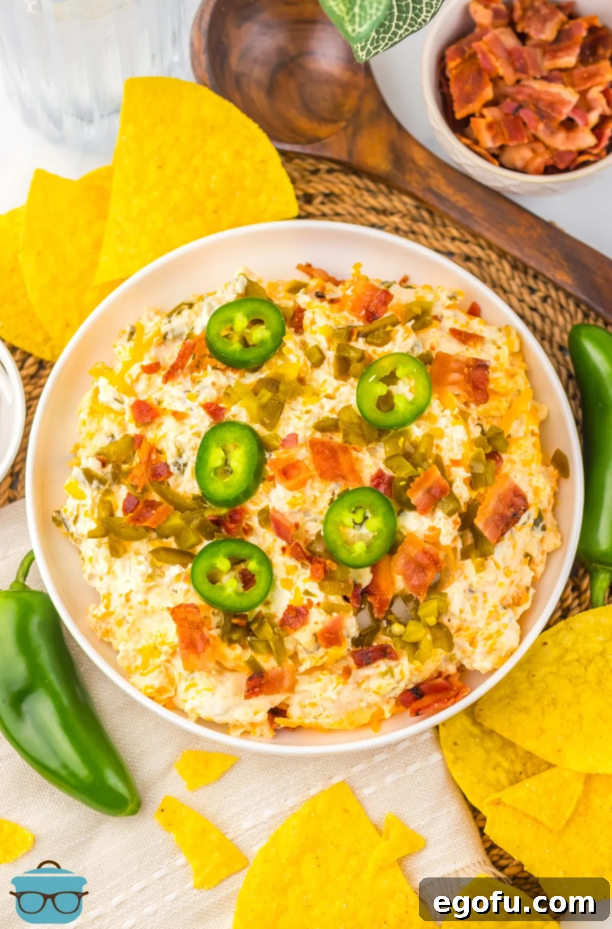 A top-down view of a large bowl filled with creamy Slow Cooker Jalapeno Popper Dip, ready to be devoured.